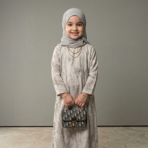 Introduce a touch of contemporary elegance to your daughter’s modest wardrobe. Our Grey Marble Abaya Kid features a unique, soft-textured print that offers a refreshing break from solid colors while maintaining a sophisticated, minimalist look. It is the perfect choice for the little fashionista who loves to look stylish yet modest.