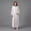 Embrace a new level of minimalist luxury with our Ivory Classic Abaya. This piece stands out with its clean architectural lines and unique asymmetric button fastening that adds a contemporary twist to the classic silhouette. Designed for the woman who loves "Quiet Luxury," it offers a bright, refreshing aesthetic perfect for daytime events, formal gatherings, or professional settings.