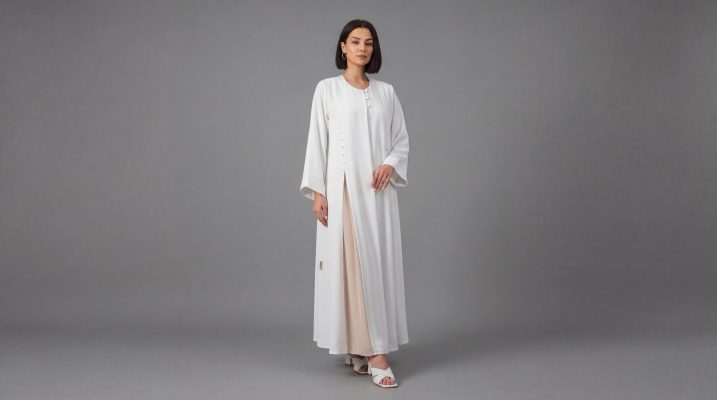 Embrace a new level of minimalist luxury with our Ivory Classic Abaya. This piece stands out with its clean architectural lines and unique asymmetric button fastening that adds a contemporary twist to the classic silhouette. Designed for the woman who loves "Quiet Luxury," it offers a bright, refreshing aesthetic perfect for daytime events, formal gatherings, or professional settings.