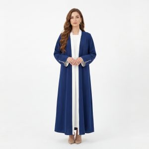 Refine your everyday wardrobe with our Classic Abaya, a versatile piece designed for the modern woman who values clean lines and effortless sophistication. This open-front abaya features a striking royal blue hue accented with a crisp white contrast trim along the lapels and cuffs, offering a polished look that transitions perfectly from the office to evening gatherings.