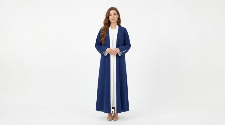 Refine your everyday wardrobe with our Classic Abaya, a versatile piece designed for the modern woman who values clean lines and effortless sophistication. This open-front abaya features a striking royal blue hue accented with a crisp white contrast trim along the lapels and cuffs, offering a polished look that transitions perfectly from the office to evening gatherings.