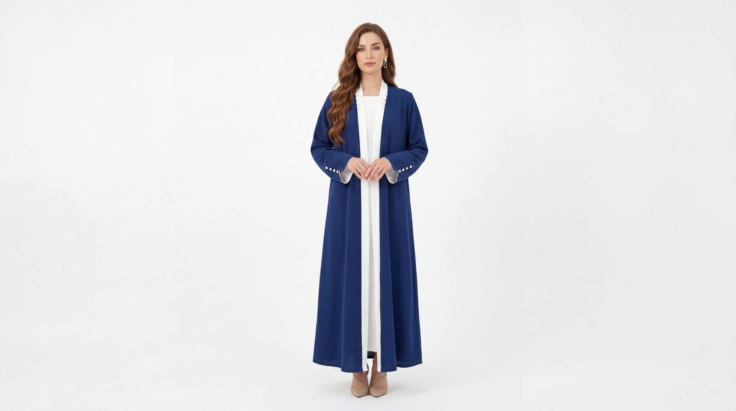 Royal Blue Classic Open Abaya with Contrast White Trim – Elegant Professional Modest Wear Refine your everyday wardrobe with our Classic Abaya, a versatile piece designed for the modern woman who values clean lines and effortless sophistication. This open-front abaya features a striking royal blue hue accented with a crisp white contrast trim along the lapels and cuffs, offering a polished look that transitions perfectly from the office to evening gatherings.