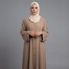 Add a touch of warmth and sophistication to your modest collection with our Camel Classic Abaya. This piece features a traditional button-down front and a relaxed silhouette that offers both comfort and effortless style. The neutral earthy tone makes it a versatile staple, perfect for layering during daily errands, office hours, or casual weekend gatherings.