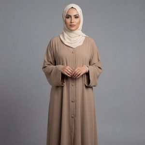 Add a touch of warmth and sophistication to your modest collection with our Camel Classic Abaya. This piece features a traditional button-down front and a relaxed silhouette that offers both comfort and effortless style. The neutral earthy tone makes it a versatile staple, perfect for layering during daily errands, office hours, or casual weekend gatherings.