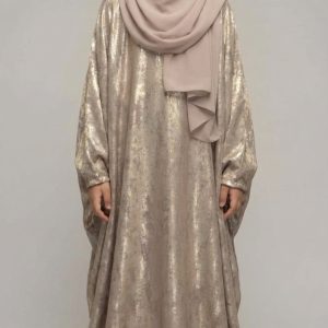 Make your little princess shine at her next special event with our Metallic Gold Abaya Kid. This stunning piece is designed for those moments that require a touch of glamour—whether it’s Eid, a wedding, or a formal family celebration. The fabric catches the light beautifully, ensuring she feels like the star of the show.