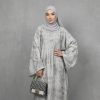 Elevate your modest wardrobe with our Premium Grey Textured Closed Abaya. This piece is the epitome of sophisticated simplicity, designed for the modern woman who values both style and tradition. Crafted from a high-quality, breathable fabric with a unique marble-like texture, this abaya offers a graceful drape and effortless silhouette.