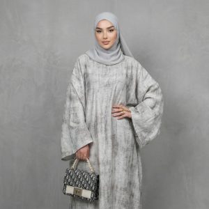 Elevate your modest wardrobe with our Premium Grey Textured Closed Abaya. This piece is the epitome of sophisticated simplicity, designed for the modern woman who values both style and tradition. Crafted from a high-quality, breathable fabric with a unique marble-like texture, this abaya offers a graceful drape and effortless silhouette.