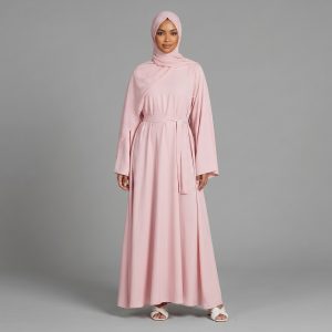 Discover the perfect harmony of femininity and modesty with our Dusty Rose Belted Closed Abaya. This stunning piece features a streamlined, closed-front design crafted from a fluid, high-quality fabric that offers a flattering silhouette. With its adjustable waist tie and graceful drape, it is a versatile addition to any wardrobe, designed for the woman who loves a touch of refined color.