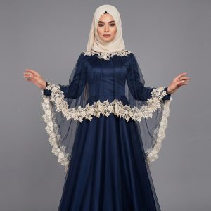 Step into elegance with our Midnight Navy Cape Abaya, a stunning piece designed for those who love a touch of vintage glamour. This abaya features a unique tiered cape design made of delicate sheer mesh, adorned with exquisite cream floral lace. The contrast between the deep navy satin-finish base and the soft lace details creates a balanced, sophisticated look perfect for special celebrations.