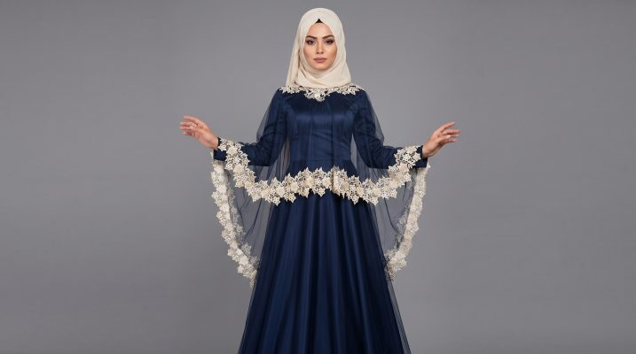 Step into elegance with our Midnight Navy Cape Abaya, a stunning piece designed for those who love a touch of vintage glamour. This abaya features a unique tiered cape design made of delicate sheer mesh, adorned with exquisite cream floral lace. The contrast between the deep navy satin-finish base and the soft lace details creates a balanced, sophisticated look perfect for special celebrations.
