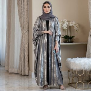 Step into the spotlight with our Butterfly Abaya, a masterpiece of modest luxury. This abaya features the iconic "Farasha" (butterfly) cut, offering an oversized, flowing silhouette that exudes grace and authority. Covered in a shimmering silver metallic finish, it’s the ultimate statement piece for high-end events and evening celebrations.